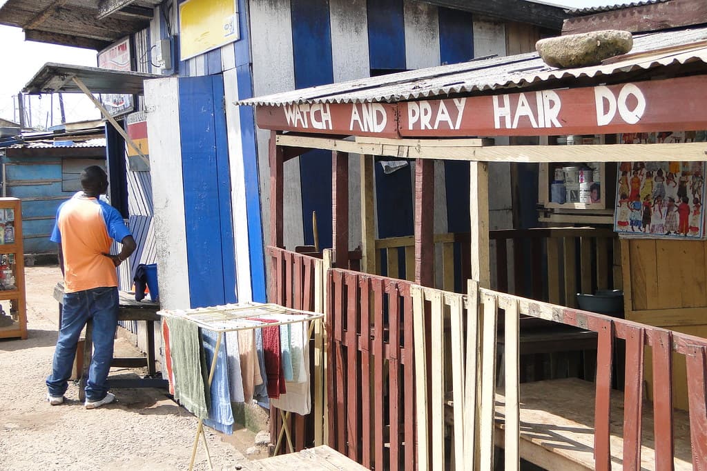 A hand-painted hair salon shopfront in Elmina